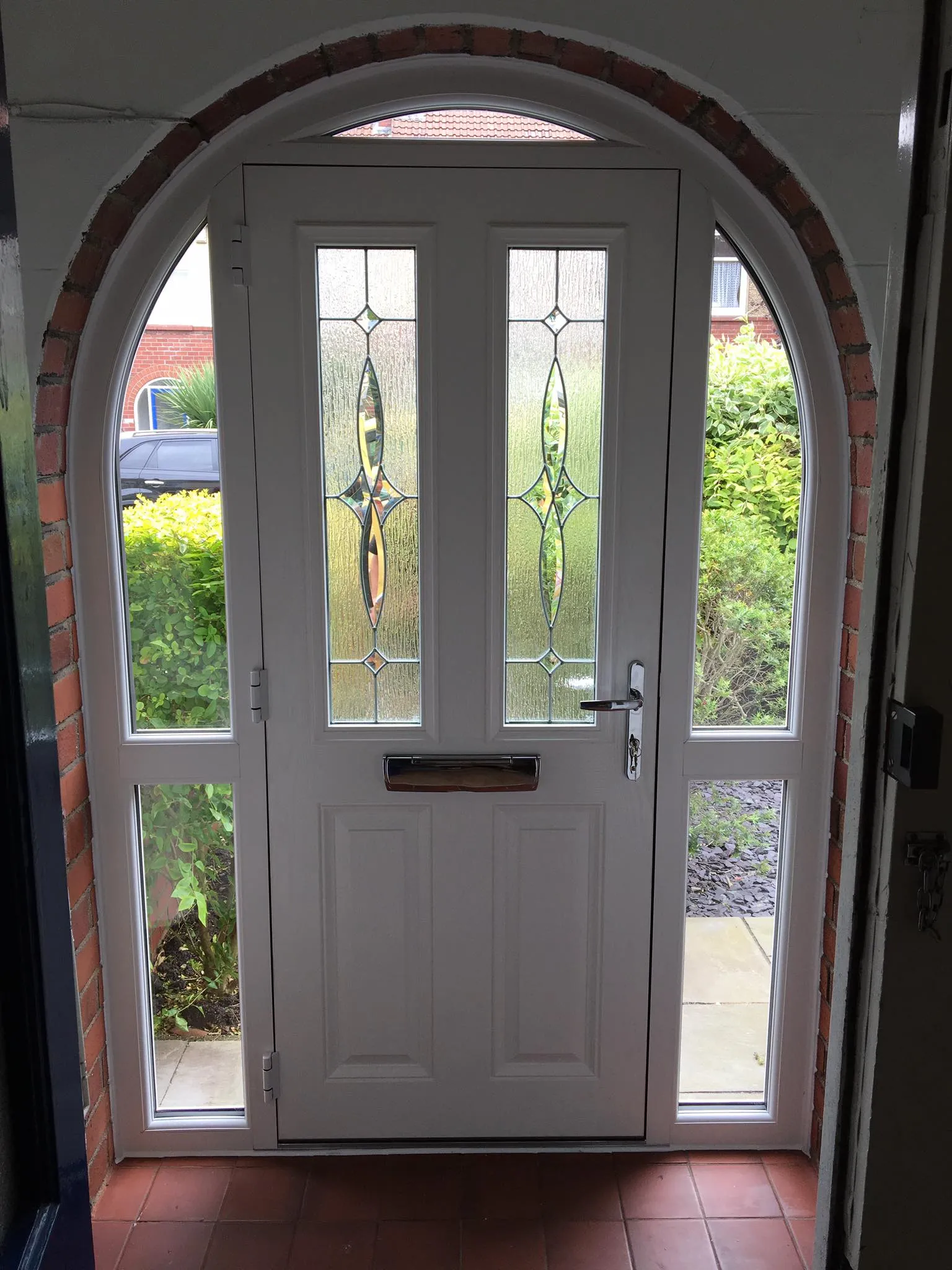 a white front door with a glass window